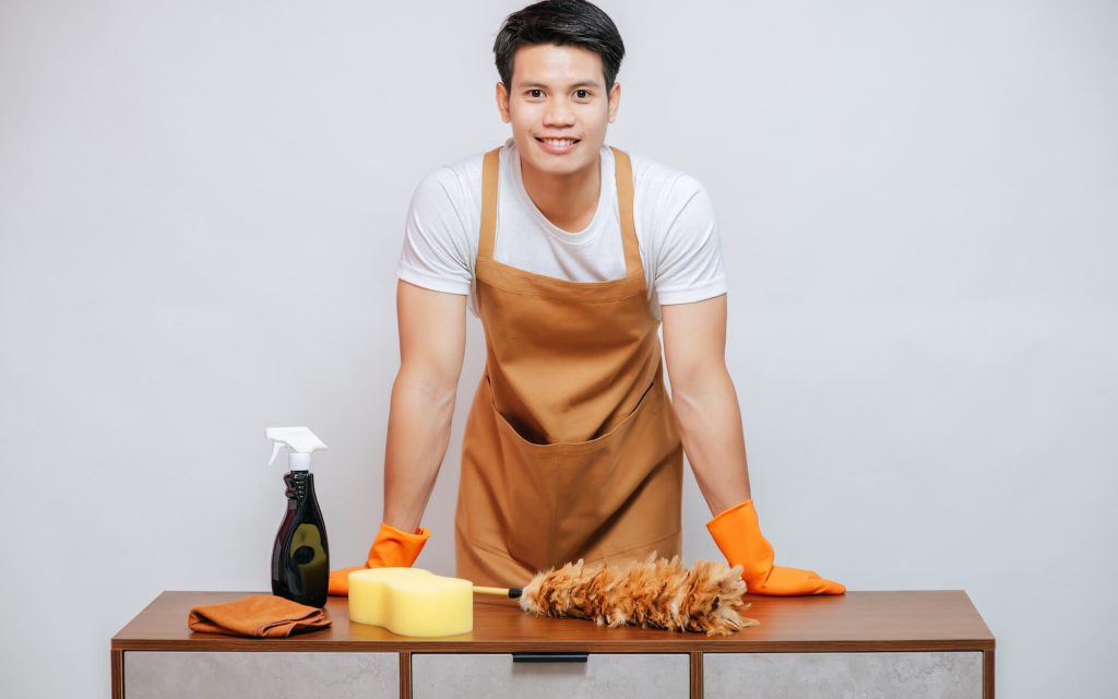 young-man-and-cleaning-equipment-on-furniture-at-h-2021-09-04-01-59-24-utc.jpg
